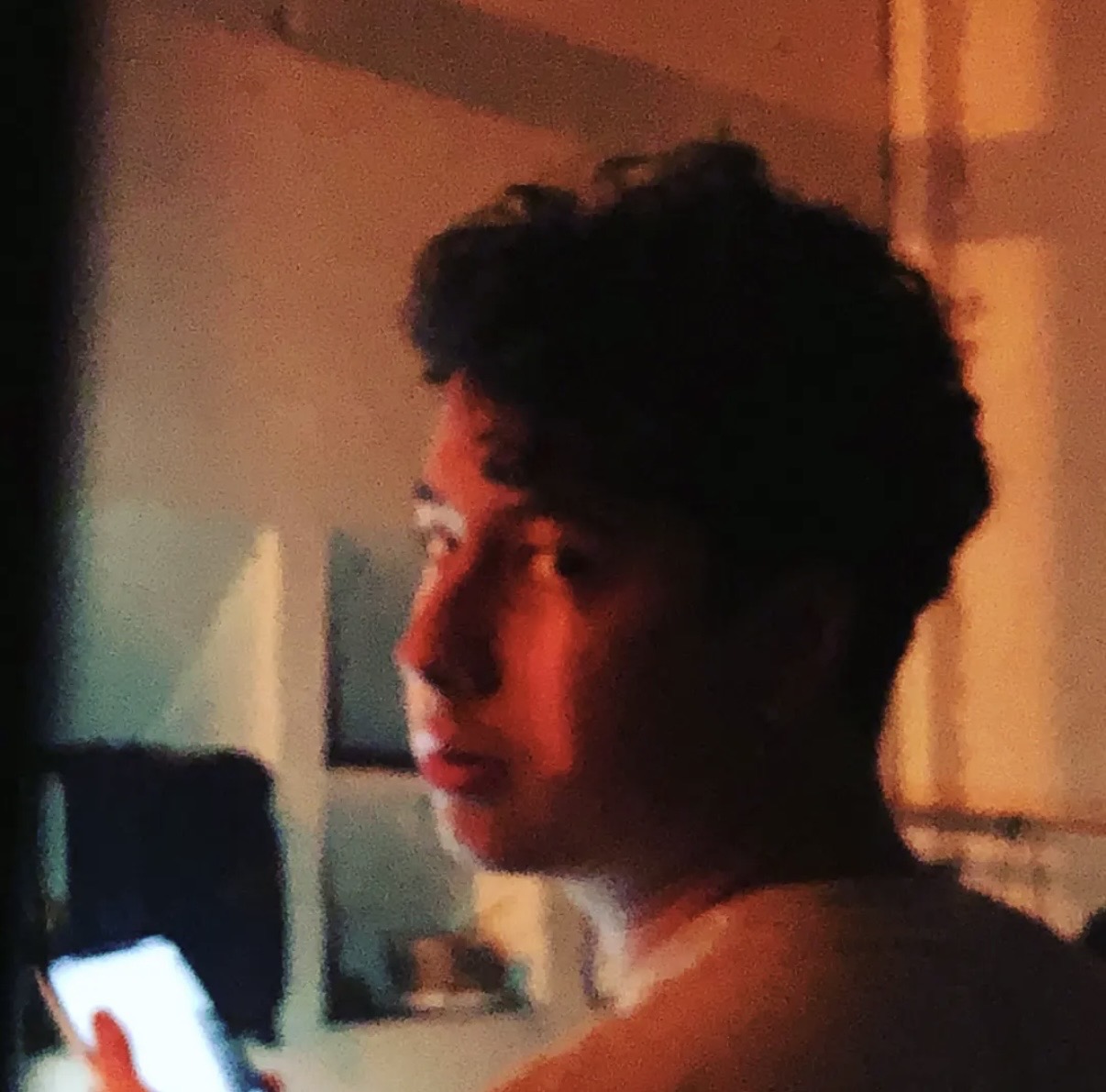 Dell Soda in a portrait under warm orange lighting