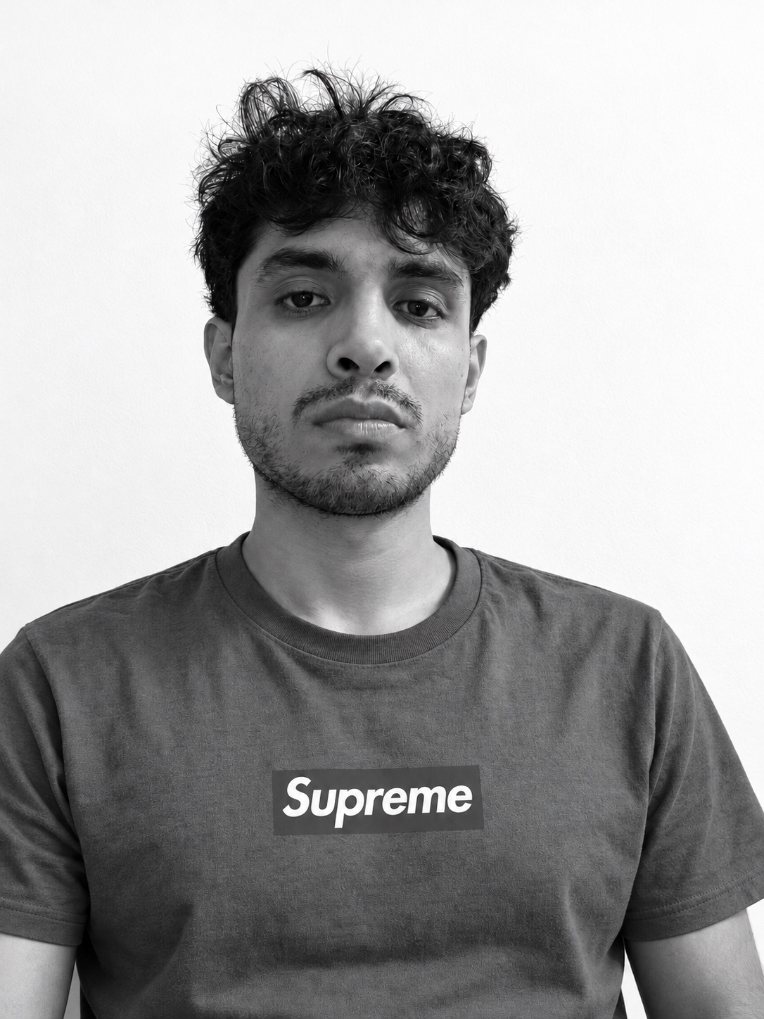 Jepo Beats in a black-and-white headshot against a white wall