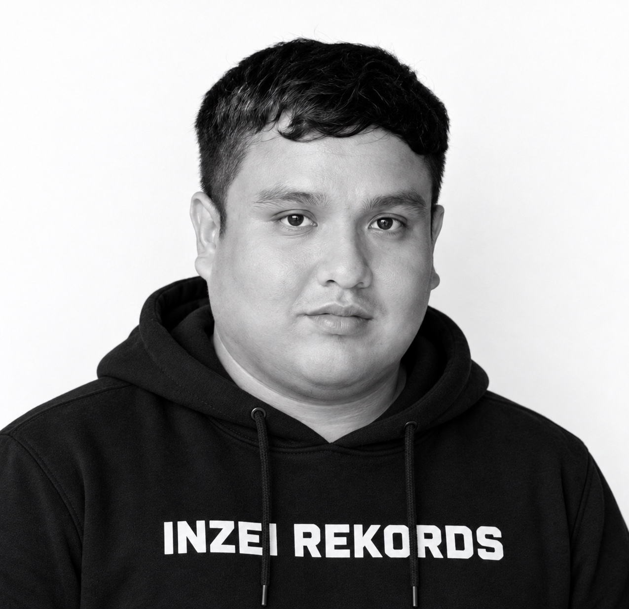 Tio Diego in a black-and-white headshot wearing an Inzei Rekords hoodie